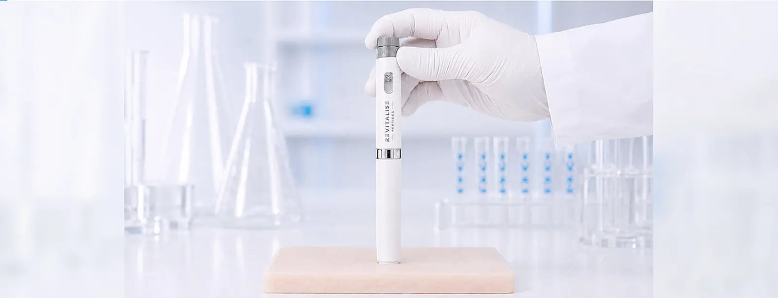 Full-length pen pressed vertically into a silicone training pad